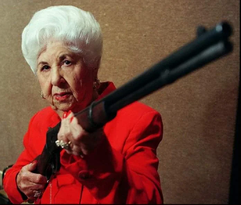 Marie Barrow Holding Cylde Barrow's Winchester